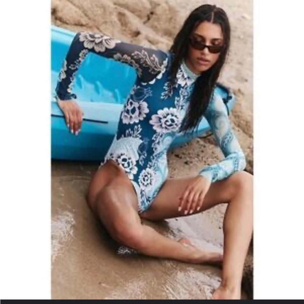 Agua Bendita Blue Floral Long-Sleeve One-Piece Swimsuit with White Accents